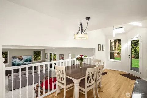 a living room with furniture a rug and white walls