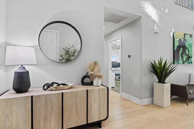 a living room with fireplace furniture and a flat screen tv
