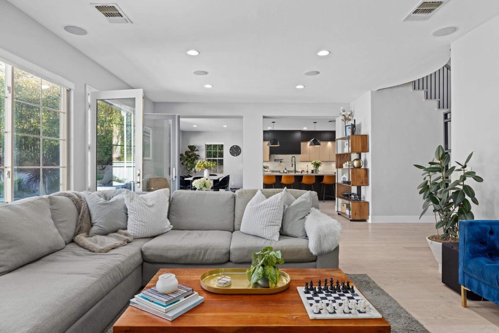 887 Genoa Way San Marcos, CA 92078 - Photo 19 of 41 a living room with furniture fireplace and a window