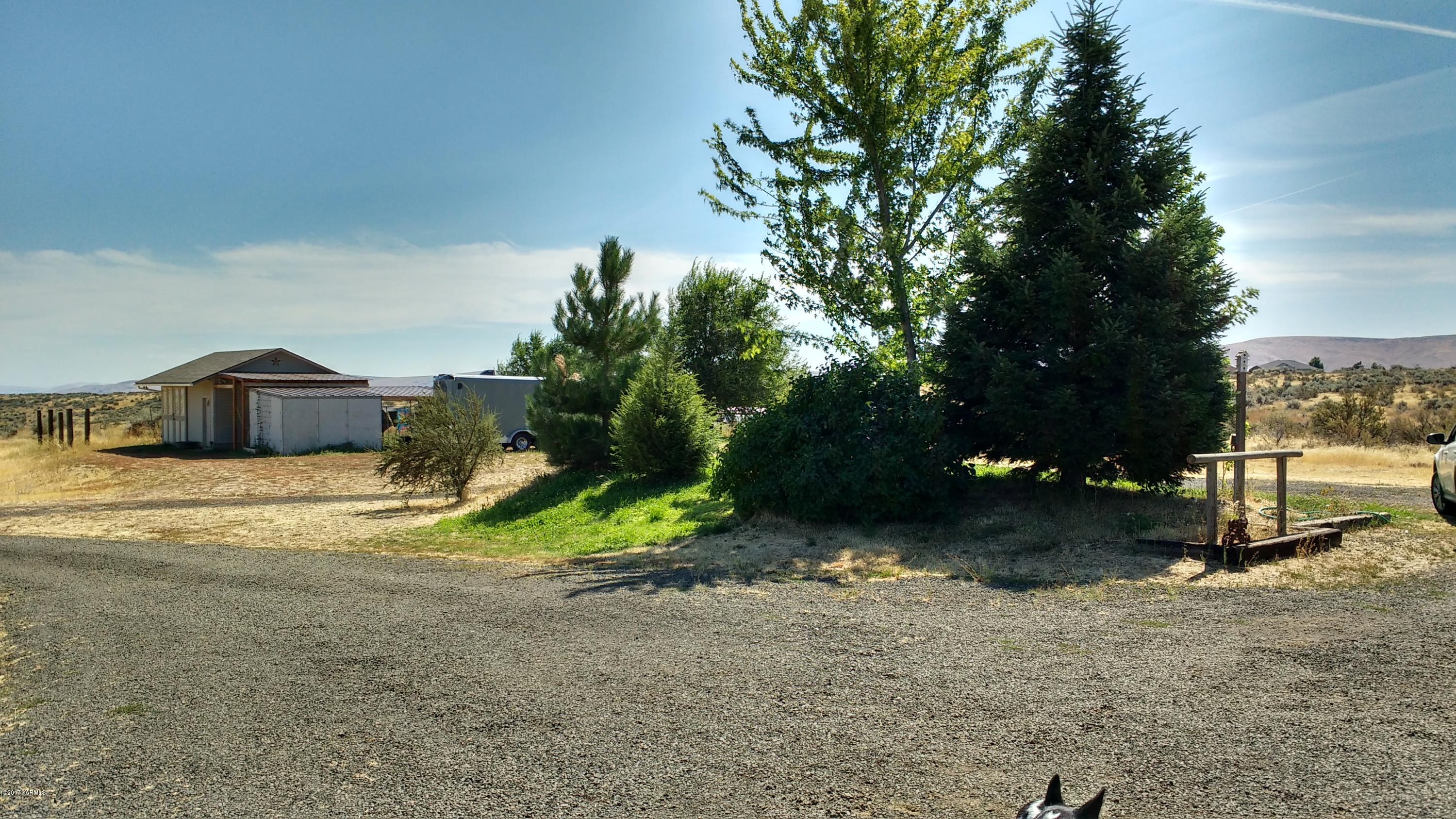 810 Red Tail Road Yakima, WA 98908 - Photo 34 of 42 a house with trees in front of it