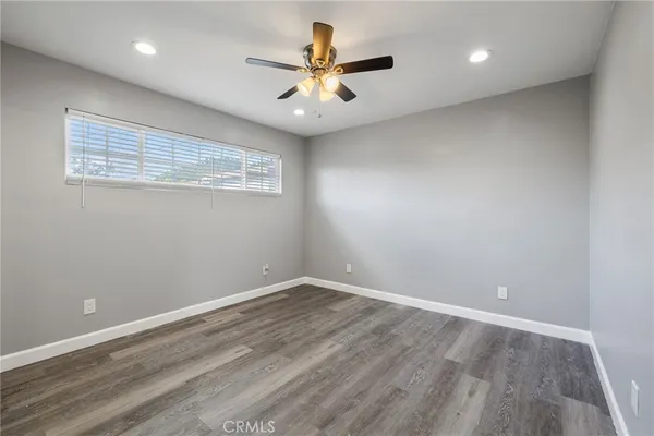 a view of room with window and ceiling fan