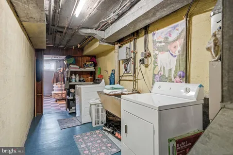a view of a storage & utility room with washer and dryer