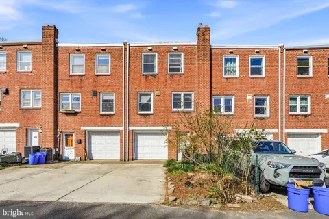 a front view of a building with many windows