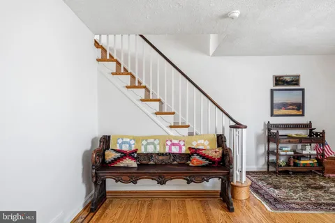 a view of entryway livingroom and hall