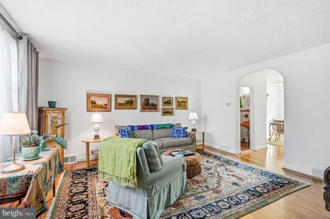 a living room with furniture and a rug