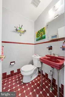 a bathroom with a sink and a toilet