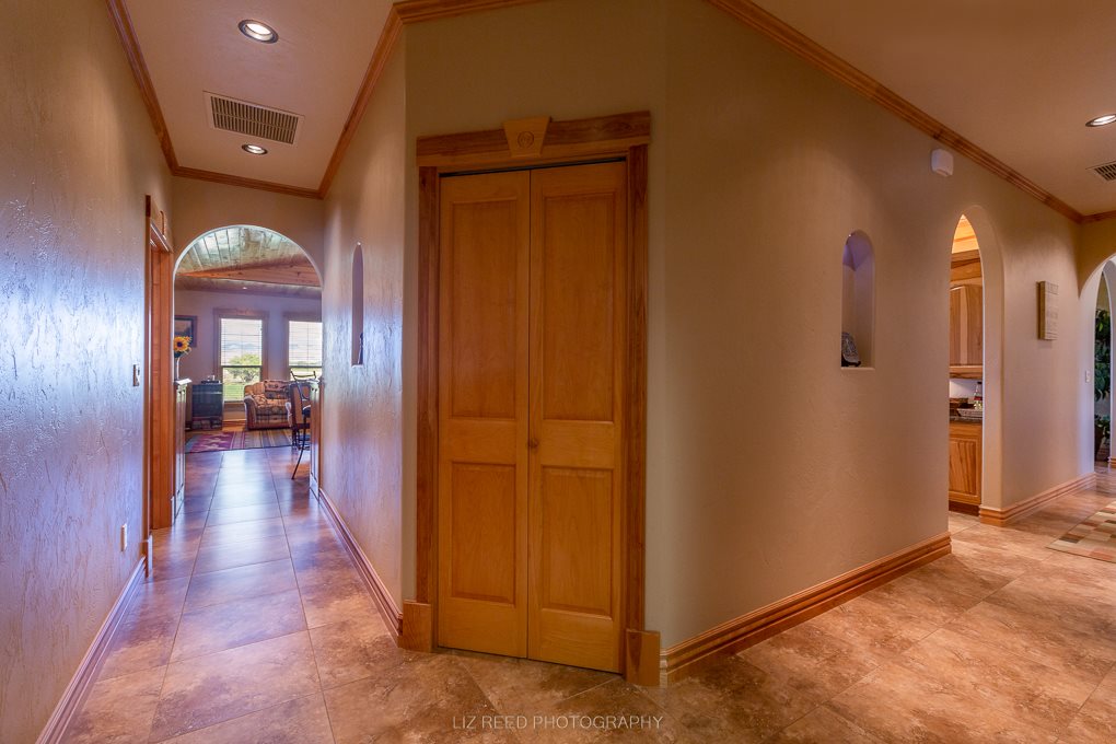 1296 O Road Loma, CO 81524 - Photo 19 of 41 a view of a hallway with wooden floor windows and livingroom with furniture