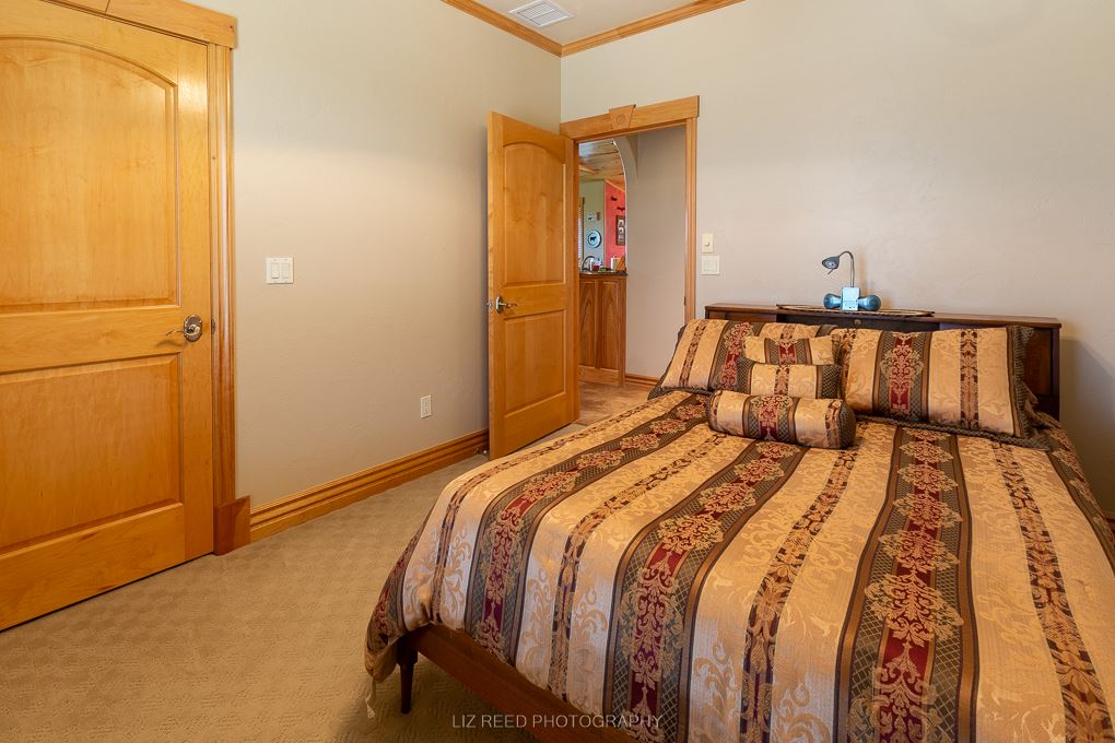 1296 O Road Loma, CO 81524 - Photo 25 of 41 a bedroom with a bed and wooden floor