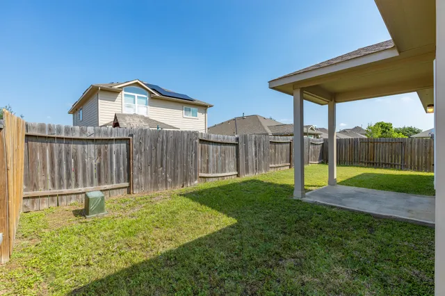 a house view with a play ground in front of it