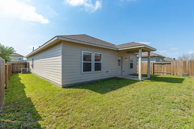 a house view with a play ground in front of it