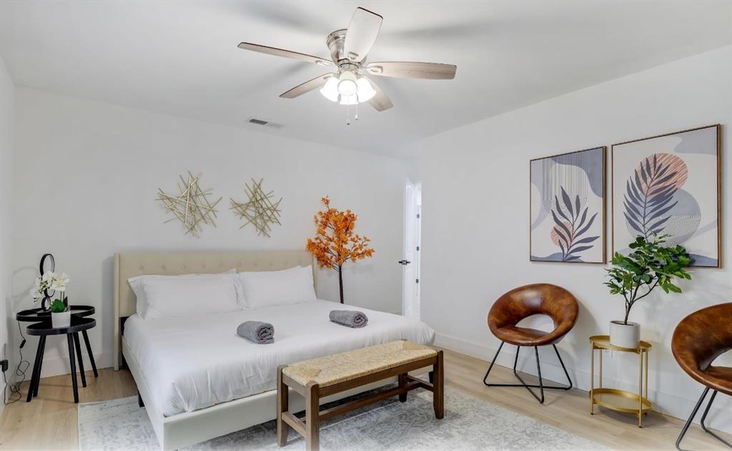 5041 Thunder Road Dallas, TX 75244 - Photo 7 of 20 a living room with furniture and a chandelier