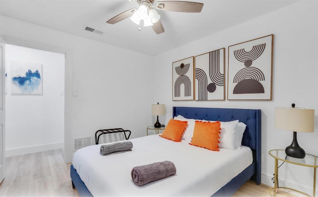 5041 Thunder Road Dallas, TX 75244 - Photo 10 of 20 a bedroom with a bed and a table in it