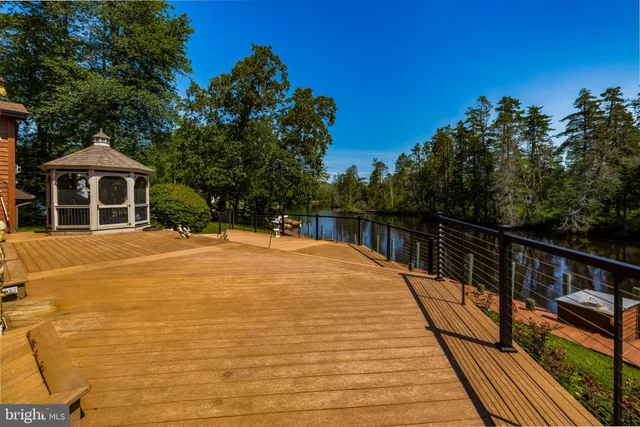 a view of a lake with outdoor seating