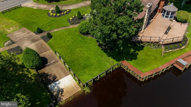 an aerial view of a house with yard