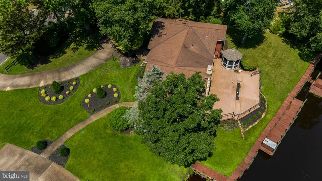 an aerial view of a house with yard
