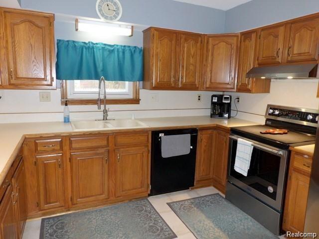 8108 Pardee Road Taylor, MI 48180 - Photo 37 of 58 37. LOTS OF WOOD CABS, NEW GOOSENECK STYLE BRUSHED NICKEL PULL-OUT FAUCET + NEWER BUILT-IN BOSCH DISHWASHER!