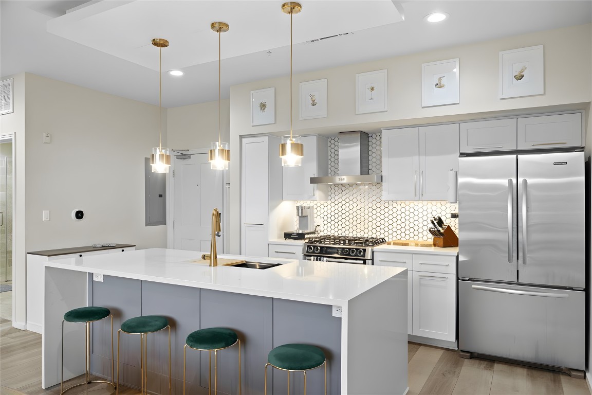 1600 Barton Springs Road, Unit 4205 Austin, TX 78704 - Photo 2 of 37 a kitchen with kitchen island a counter space and stainless steel appliances