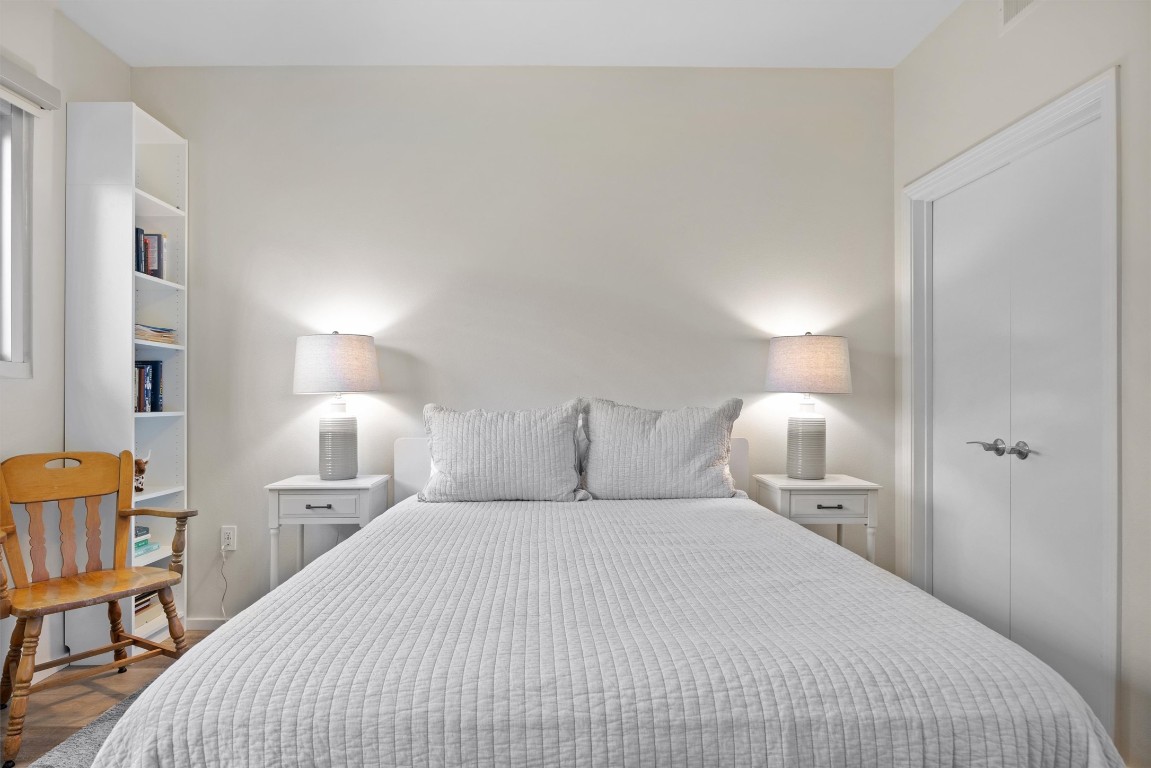 1600 Barton Springs Road, Unit 4205 Austin, TX 78704 - Photo 23 of 37 a bedroom with a bed and a lamp on table
