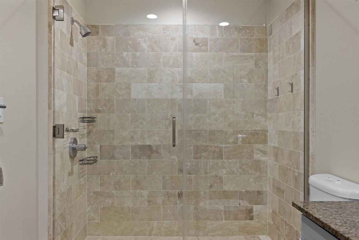 1600 Barton Springs Road, Unit 4205 Austin, TX 78704 - Photo 26 of 37 a bathroom with a granite countertop shower