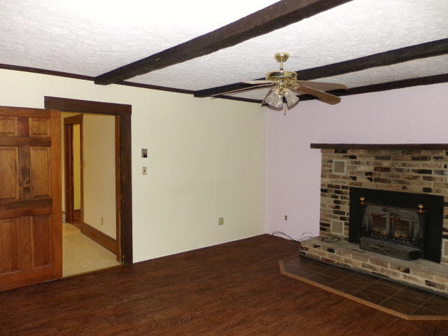 171 Ridge Hollow Road Edinburg, VA 22824 - Photo 8 of 18 a living room with furniture and a fireplace