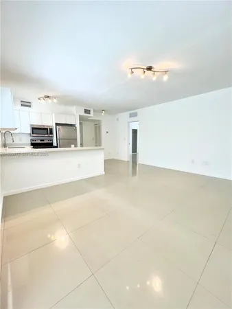 a view of a kitchen with a sink