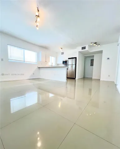 a view of a kitchen with a sink and a dishwasher cabinets