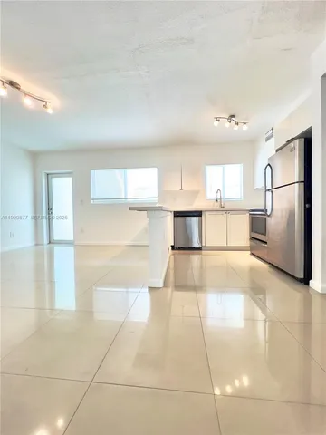 a view of a kitchen with a sink