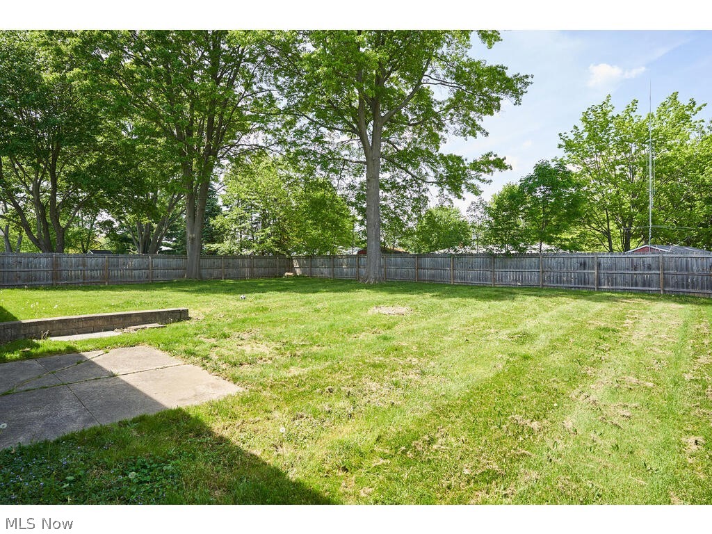 2937 Greenridge Road Barberton, OH 44203 - Photo 16 of 17 Back yard is very private and feels like a park. Wood fence surrounds the whole property with gates on either side.