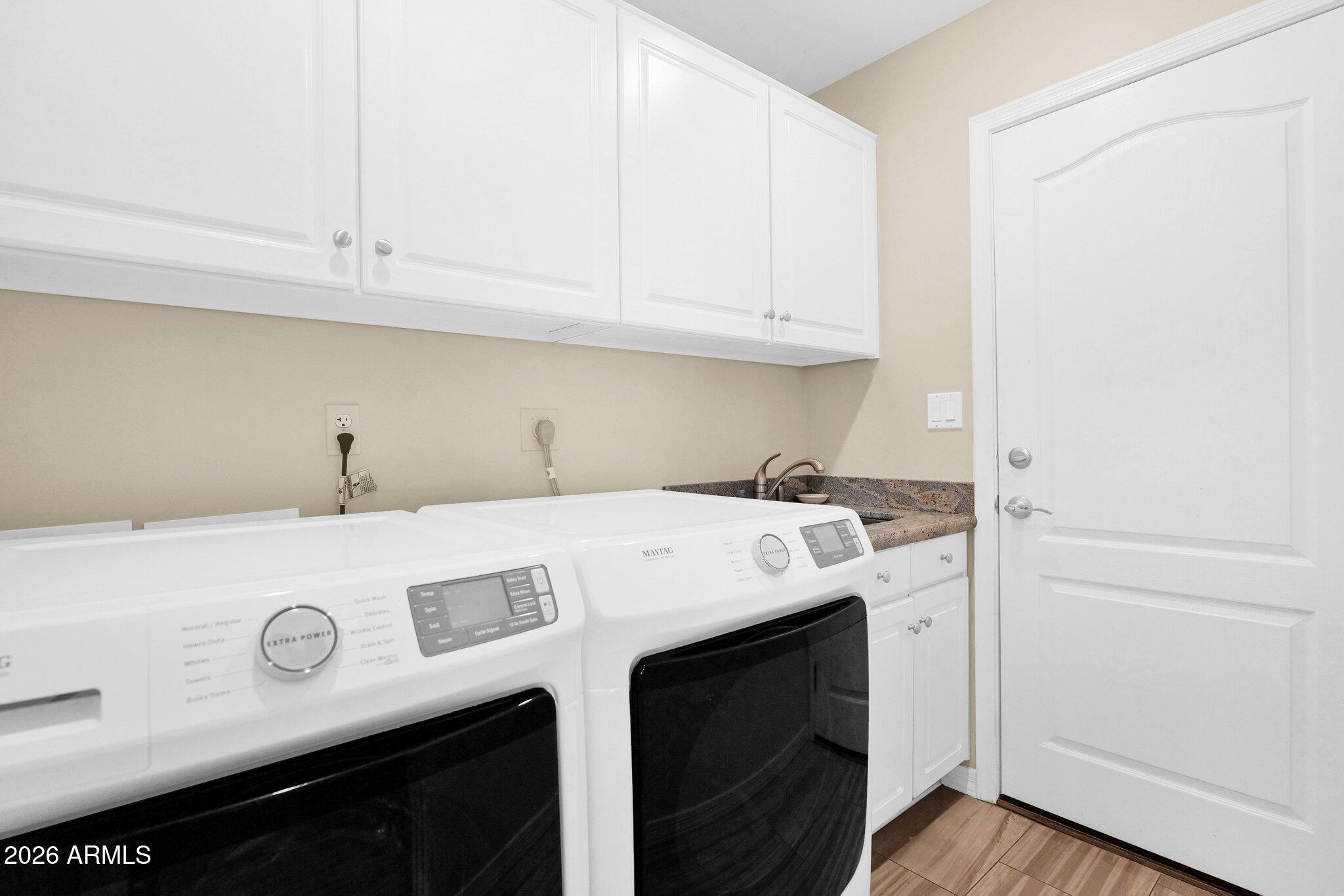 5830 East McKellips Road, Unit 110 Mesa, AZ 85215 - Photo 30 of 45 a utility room with dryer and washer
