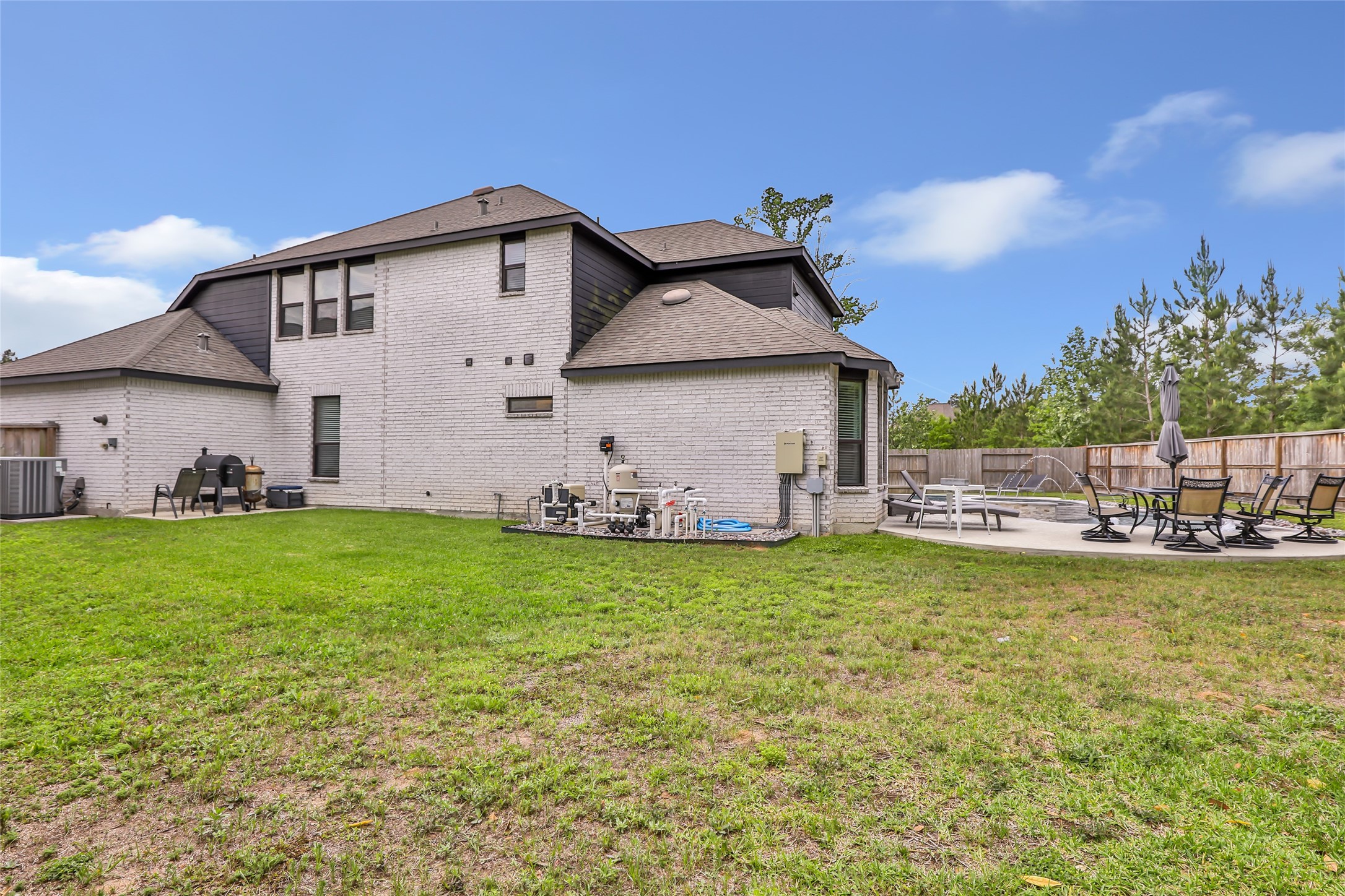 527 Chestnut Reef Court Conroe, TX 77304 - Photo 32 of 40 a view of a house with backyard