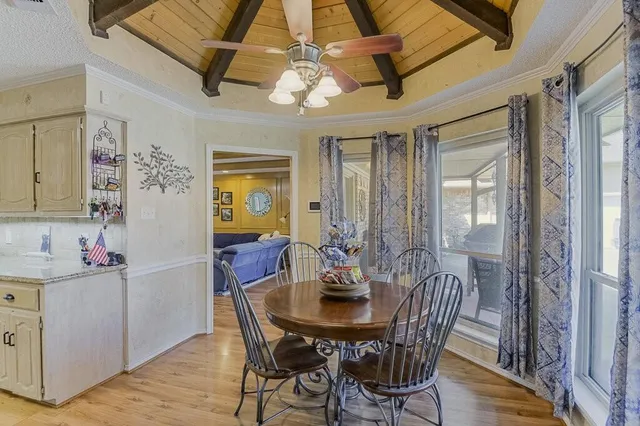 a view of a dining room with furniture and window