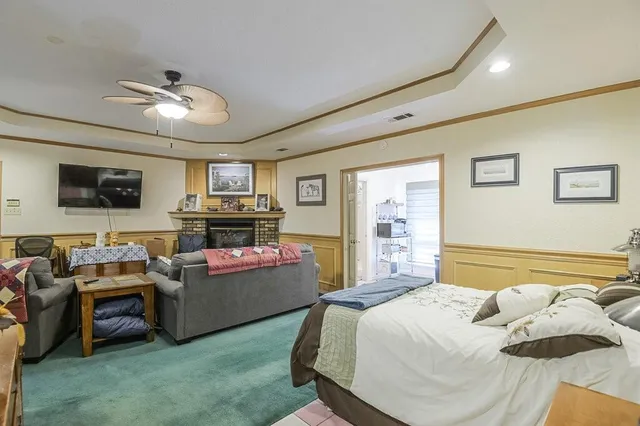 a bedroom with furniture and a flat screen tv
