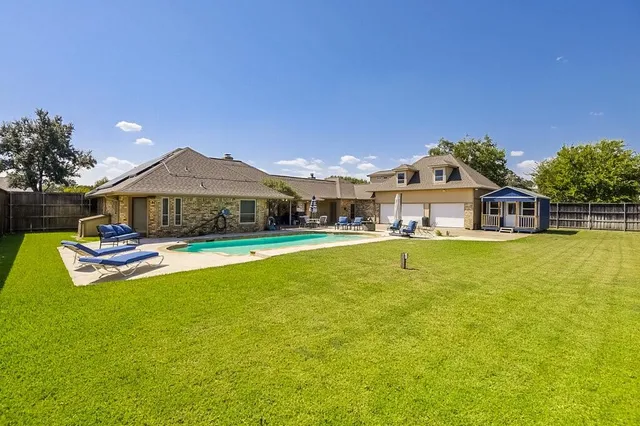 a front view of a house with swimming pool
