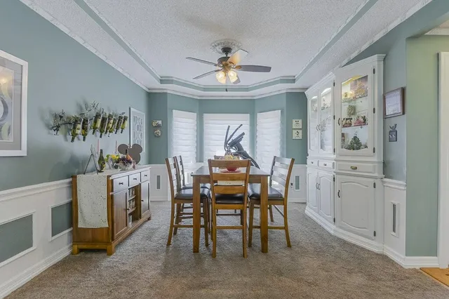 a workspace with furniture window and wooden floor