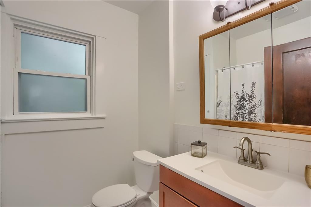 3990 Drexel Road Pittsburgh, PA 15212 - Photo 22 of 25 The second floor bath has a window, full sized shower and tub with an updated vanity.