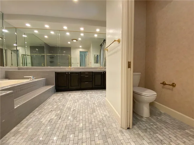 a bathroom with a bathtub and a toilet