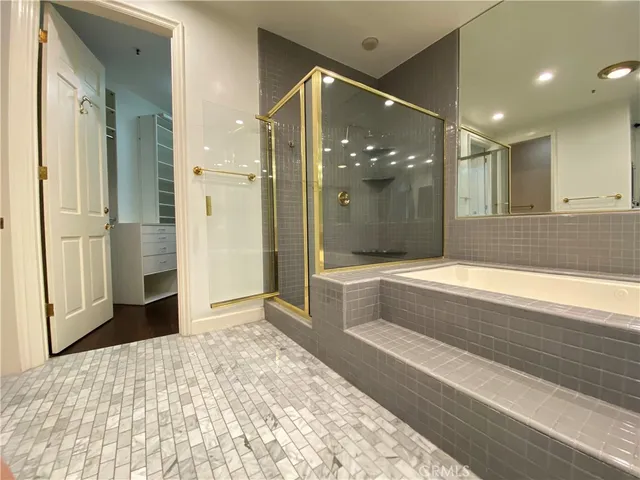 a bathroom with a bathtub and a shower