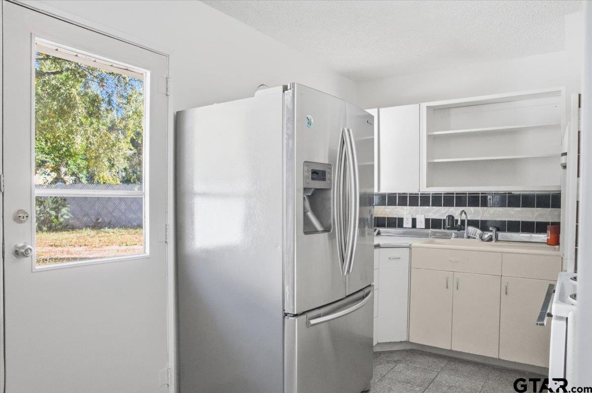 1835 Melba Drive Tyler, TX 75701 - Photo 11 of 28 a white refrigerator freezer sitting inside of a kitchen