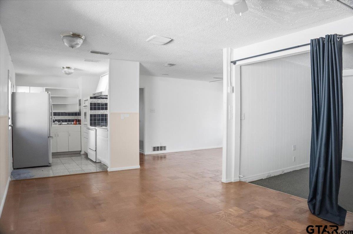 1835 Melba Drive Tyler, TX 75701 - Photo 15 of 28 a view of a kitchen with refrigerator