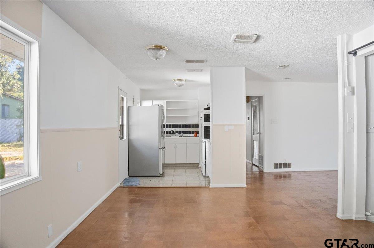 1835 Melba Drive Tyler, TX 75701 - Photo 7 of 28 a view of kitchen with refrigerator and window