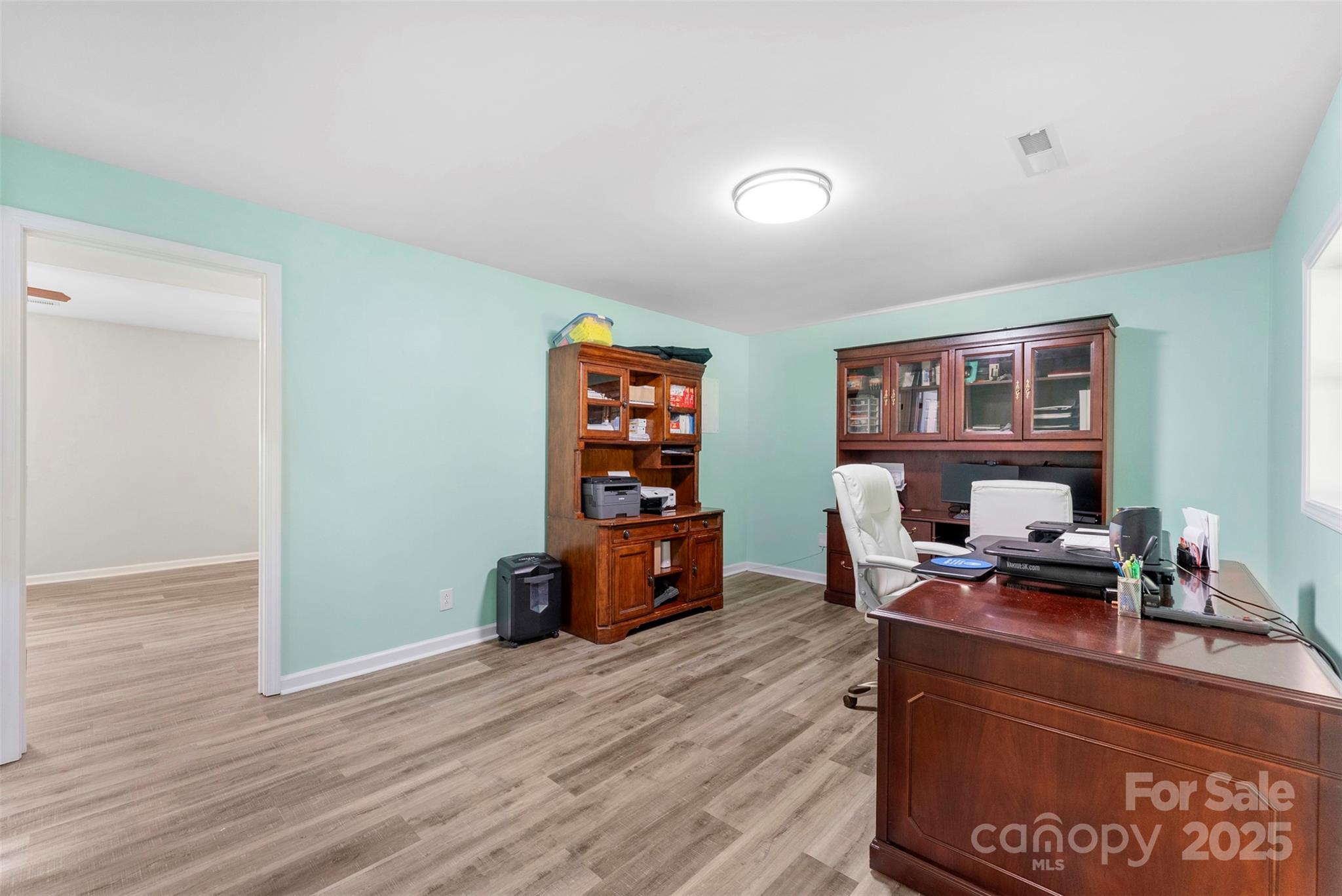 1822 North New Hope Road Gastonia, NC 28054 - Photo 16 of 47 a living room with furniture and wooden floor