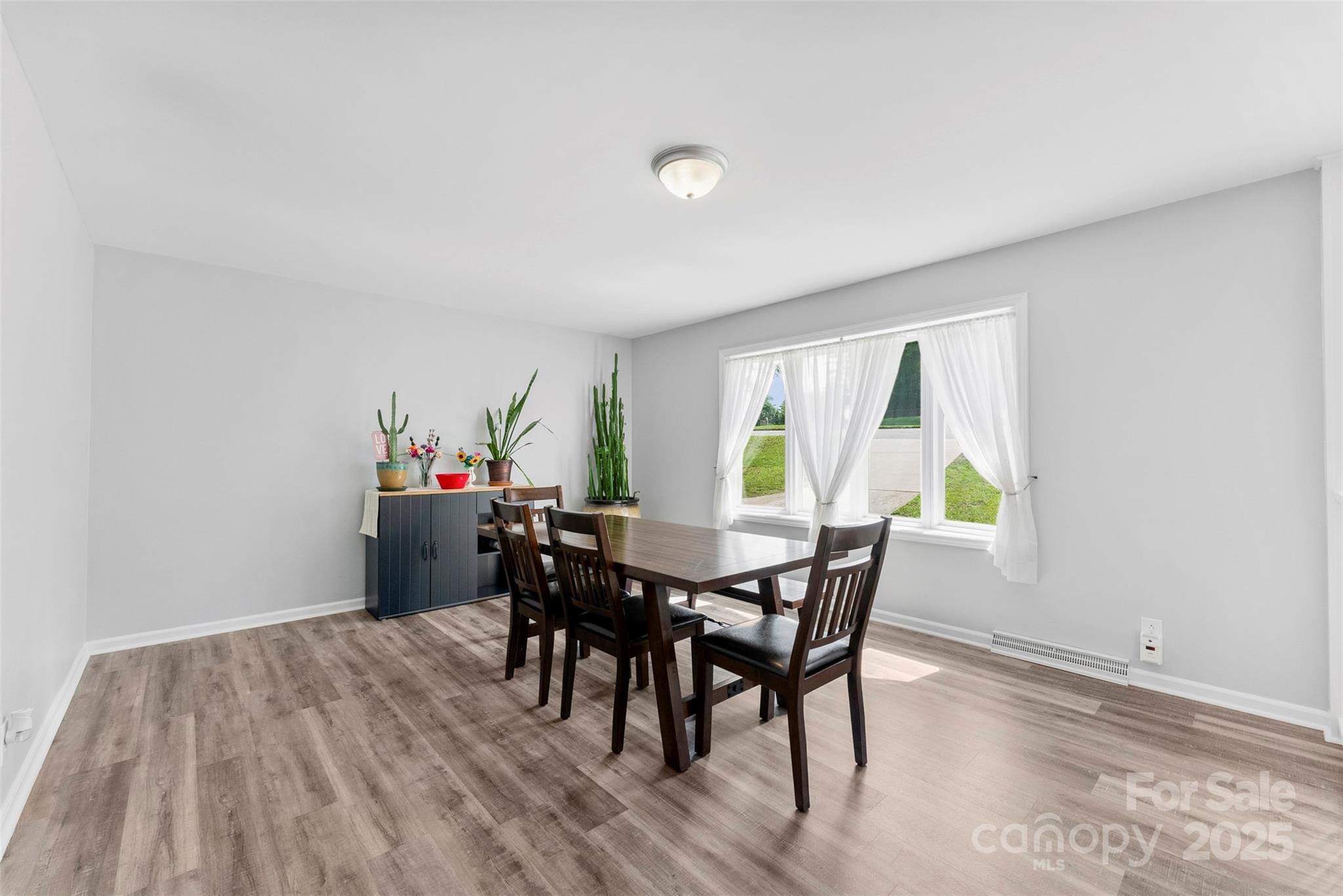 1822 North New Hope Road Gastonia, NC 28054 - Photo 18 of 47 a view of a dining room with furniture and a window