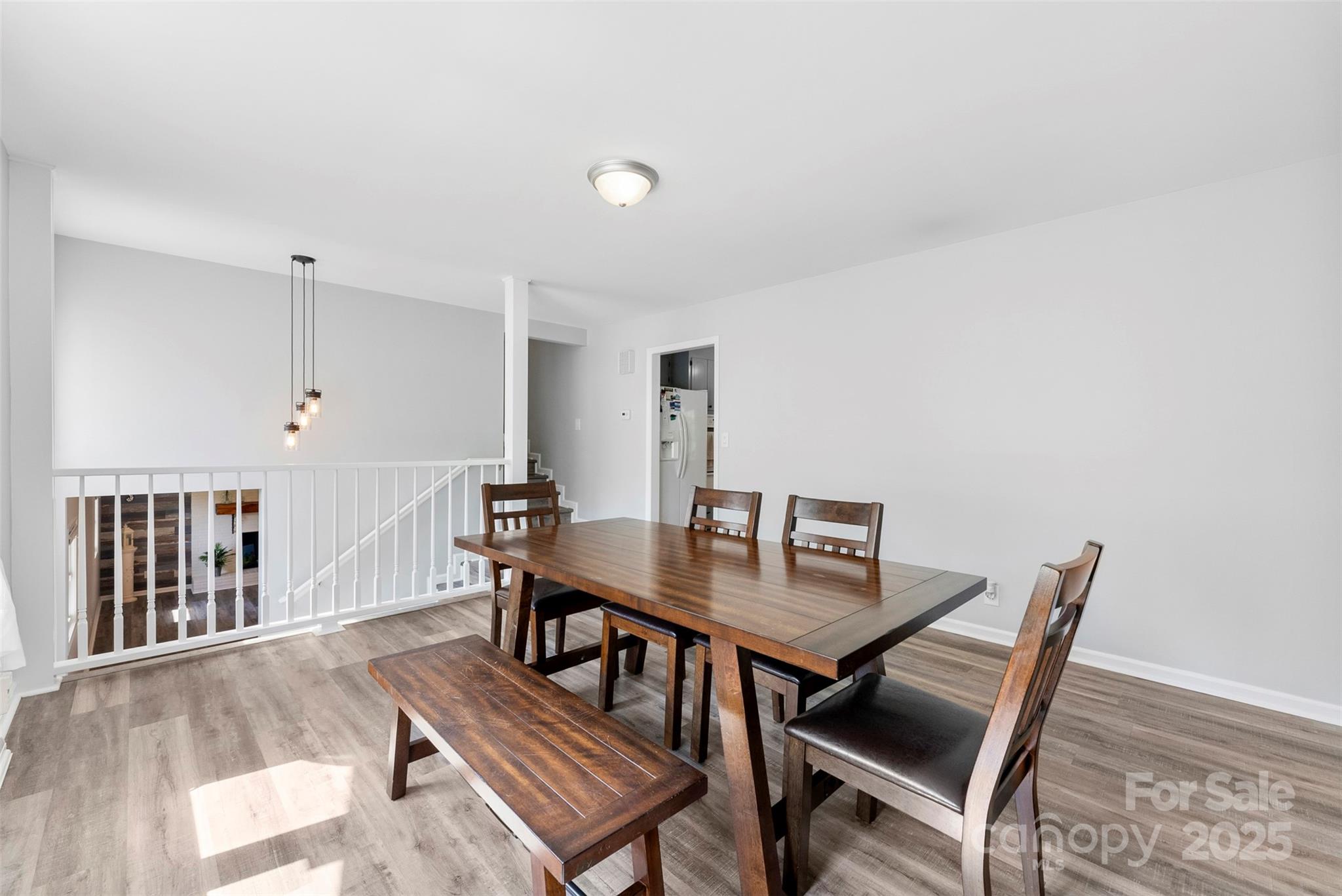 1822 North New Hope Road Gastonia, NC 28054 - Photo 19 of 47 a view of a dining room with furniture and wooden floor