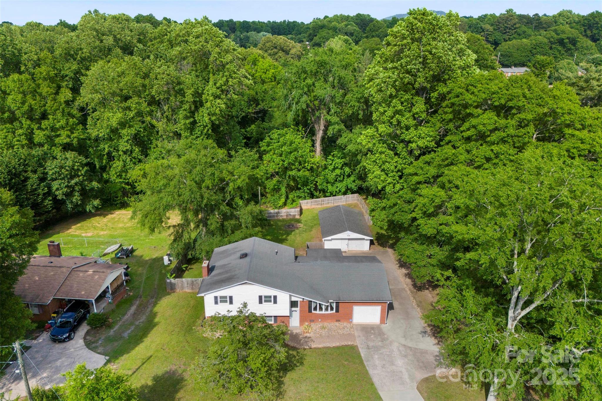 1822 North New Hope Road Gastonia, NC 28054 - Photo 2 of 47 an aerial view of a house with swimming pool and garden view