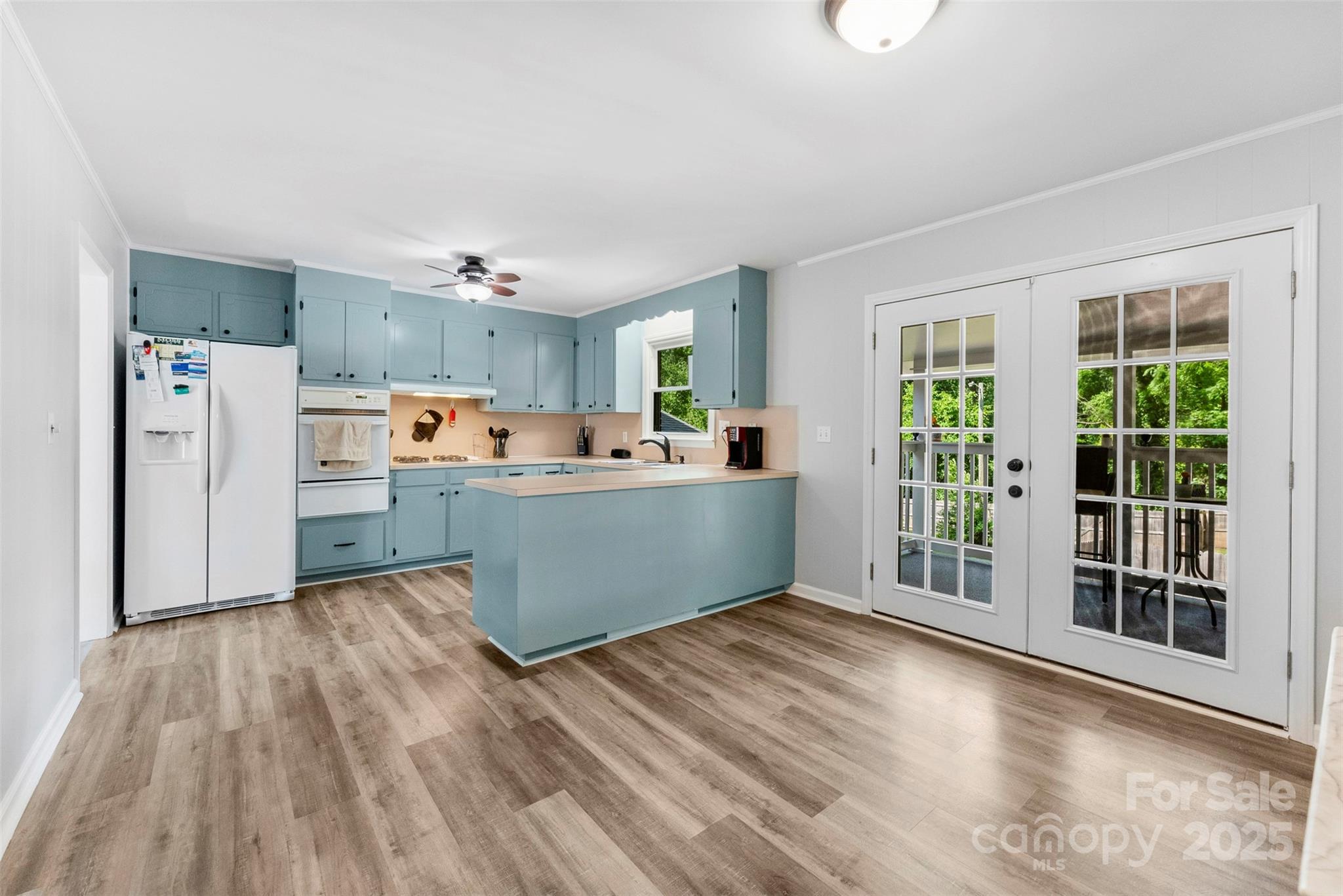 1822 North New Hope Road Gastonia, NC 28054 - Photo 25 of 47 a view of a kitchen with fridge and wooden floor