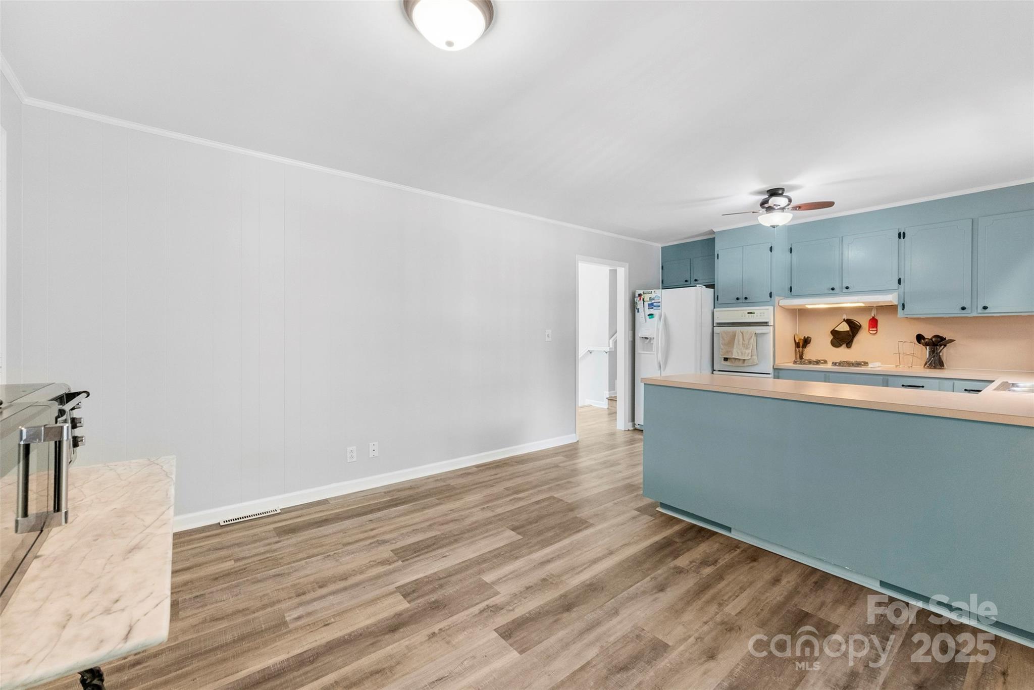 1822 North New Hope Road Gastonia, NC 28054 - Photo 26 of 47 a room with wooden floor and white walls