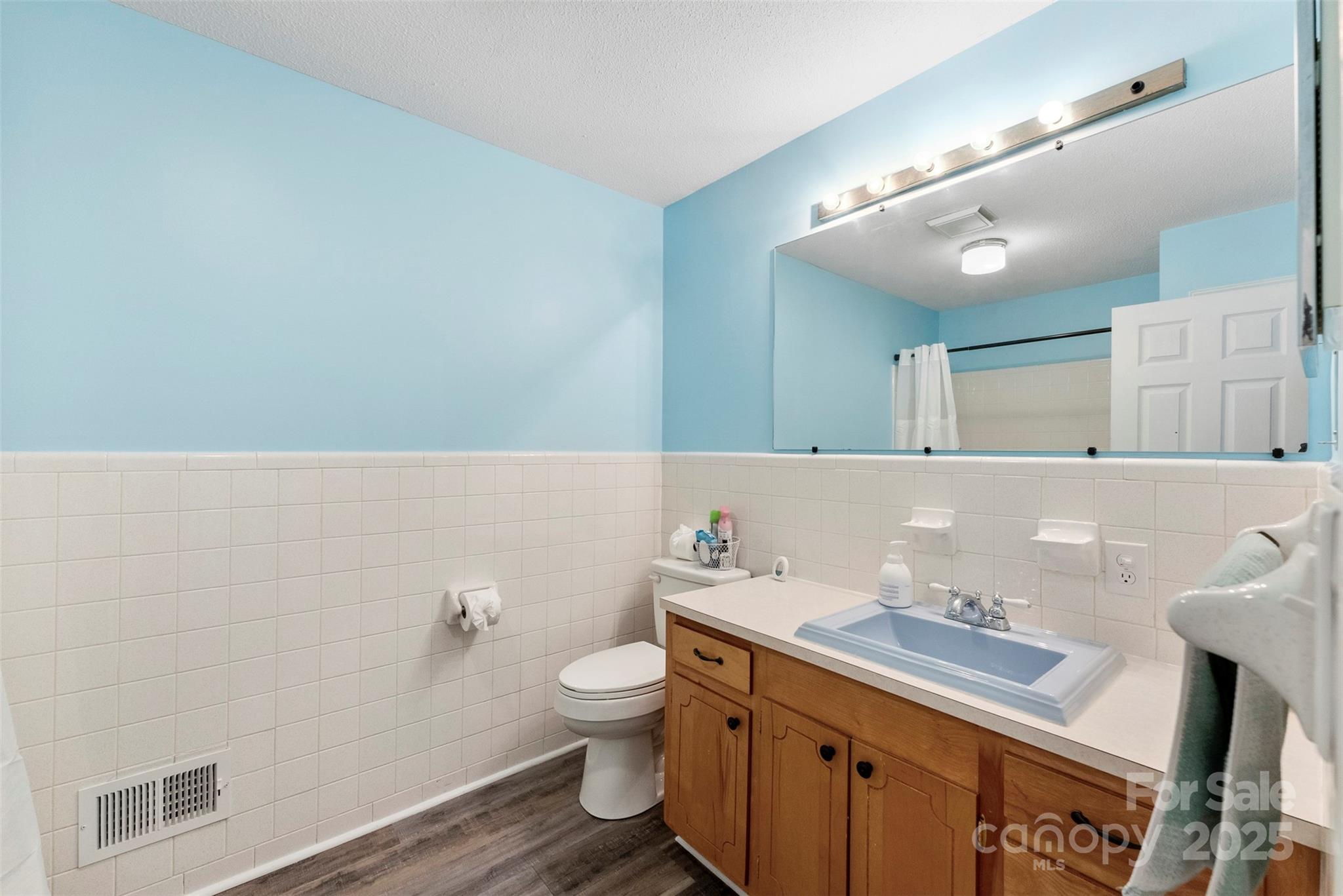 1822 North New Hope Road Gastonia, NC 28054 - Photo 27 of 47 a bathroom with a sink and a mirror