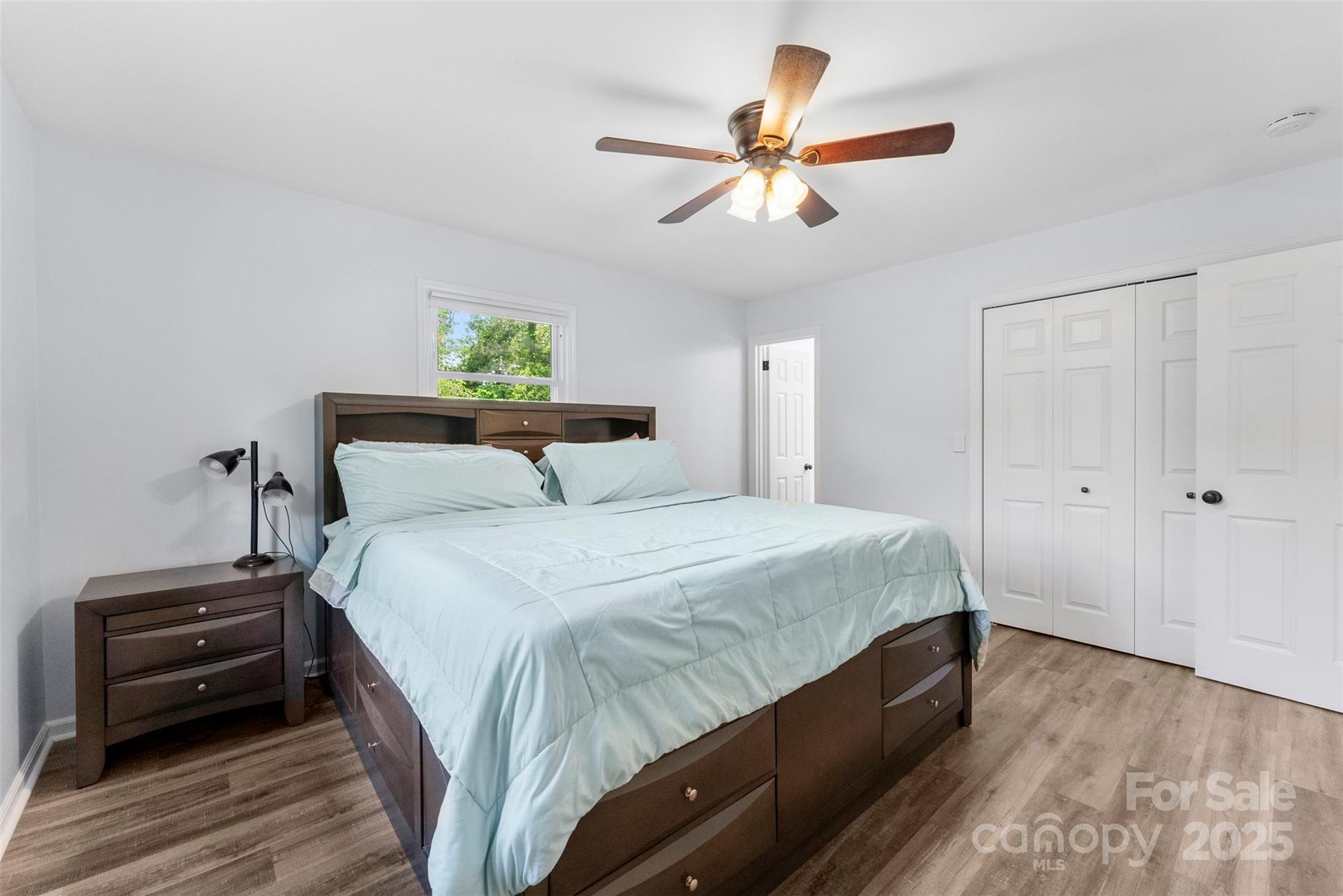 1822 North New Hope Road Gastonia, NC 28054 - Photo 32 of 47 a bedroom with a bed and a chandelier