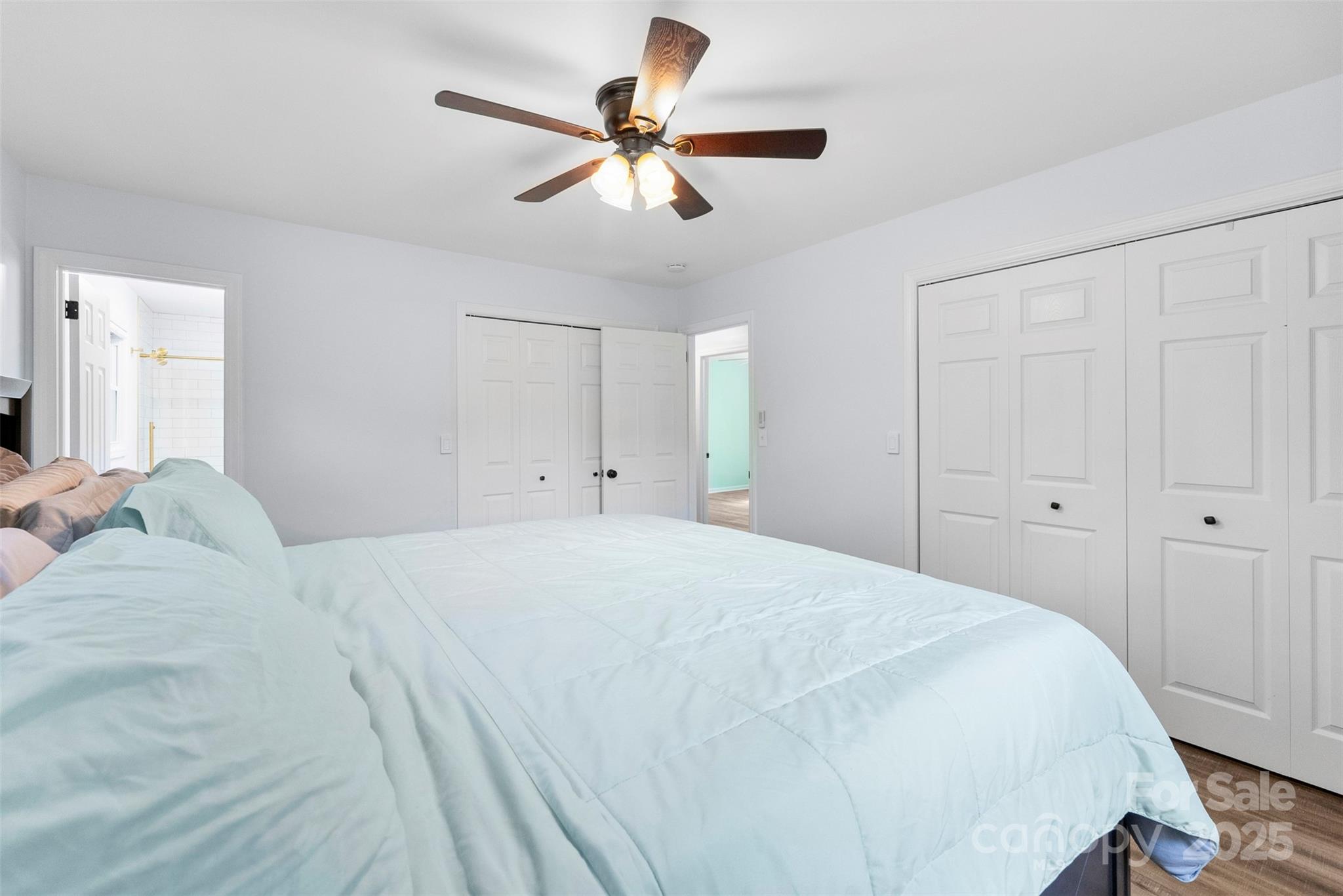 1822 North New Hope Road Gastonia, NC 28054 - Photo 33 of 47 a bedroom with a bed and a chandelier