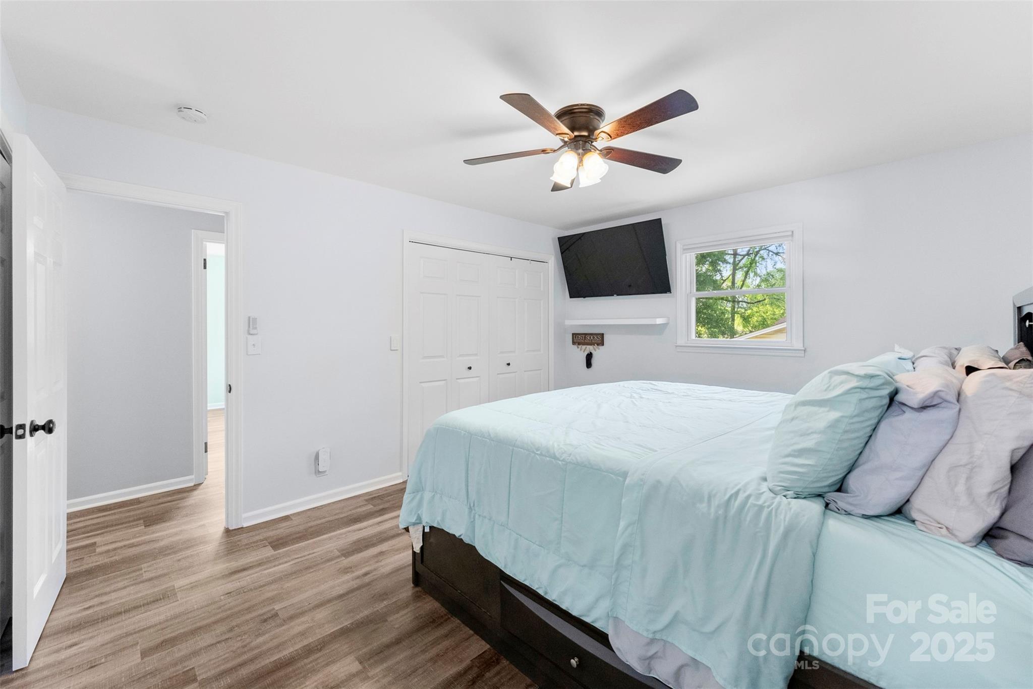 1822 North New Hope Road Gastonia, NC 28054 - Photo 34 of 47 a bedroom with a bed and a flat screen tv